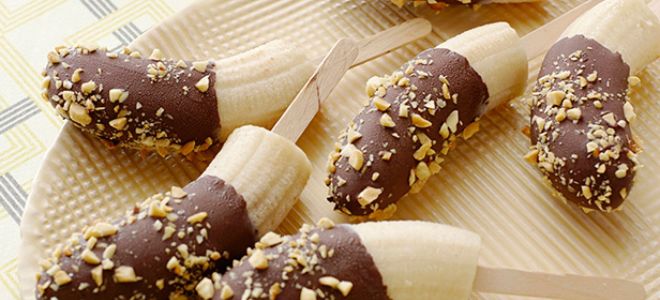 Chocolate covered banana with almonds